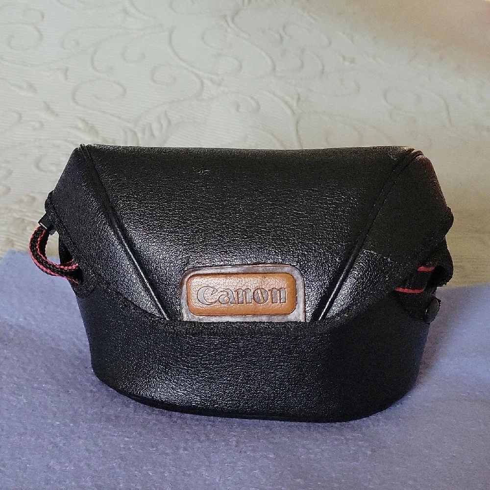 Canon Vintage Black Film Camera with Red Accents